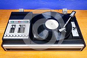 Vintage turntable vinyl record player with black vinyl