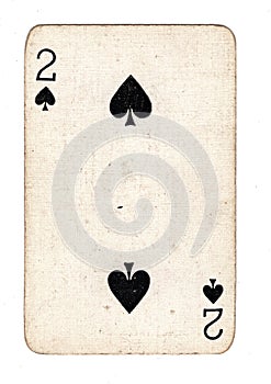 A vintage two of spades playing card.