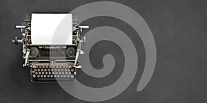 Vintage typewriter with blank sheet of paper retro technology