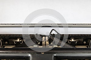 Vintage typewriter with blank sheet of paper retro technology