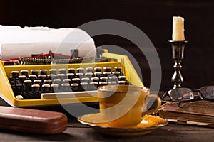 Vintage typewriter and cup of coffee