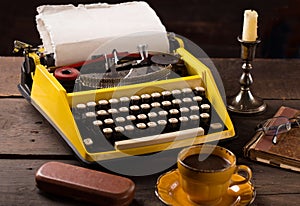 Vintage typewriter and cup of coffee