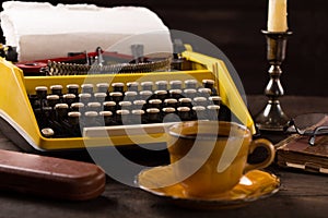Vintage typewriter and cup of coffee