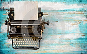 Vintage typewriter header with old paper.