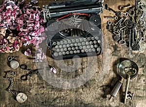 Vintage typewriter hortensia flowers old keys wooden table