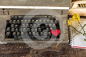 Vintage typewriter , old telephone , dry chrysanthemum flower and white paper note old wooden touch-up in still life concept