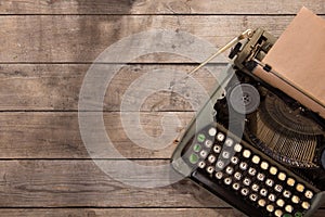 Vintage typewriter on the old wooden desk