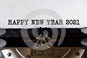 Vintage typewriter with printed text - HAPPY NEW YEAR 2021, on a sheet of paper
