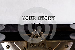 Vintage typewriter with printed text - YOUR STORY, on a sheet of paper