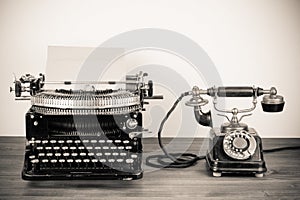 Vintage typewriter and telephone