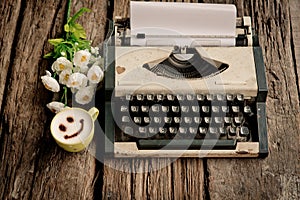 Vintage typewriter and telephone , notebook on the wood desk in