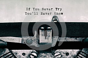 Vintage typewriter with text If you never try you\'ll never know