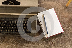 Vintage typewriter ,white  book, calculator ,pencil and candlelight on old wooden touch-up in still life concept