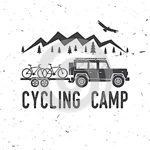 Vintage typography design with car and trailer, mountain bikes and mountain silhouette.