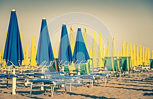Vintage umbrellas and sunbeds at Rimini Beach Italy photo