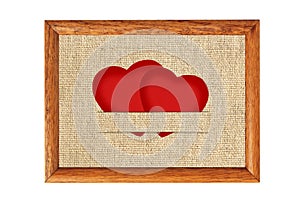 Vintage Valentine card in the form of red paper hearts on fabric