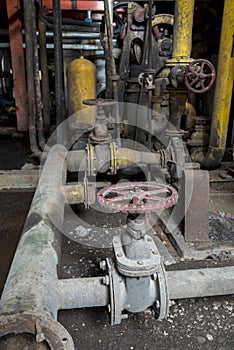 Vintage valve in heavy industry factory
