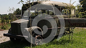 Vintage van on rural road. Old vintage bus retro style. Ruined school bus. Old retro dirty van with