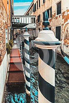 Vintage Venetian street with the crossing over the canal, Italy.