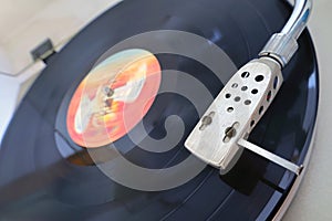 VINTAGE VINYL RECORD AND RECORD PLAYER photo