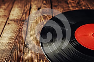 Vintage Vinyl Record on Wooden Background, Music Theme