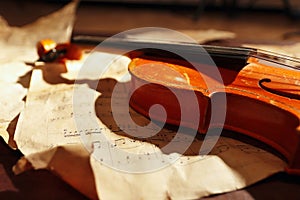 Vintage violin and old sheet music closeup