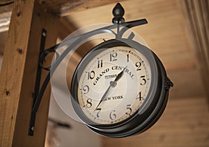 Vintage wall clock. Old style hanging clock.