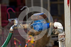 Vintage water meter and faucet closeup