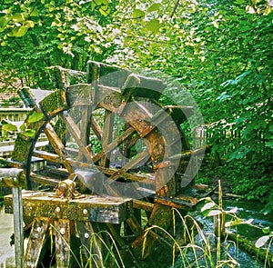 Vintage water mill wheel running