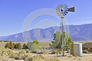 Vintage Water pump / Windmill in Rural landscape