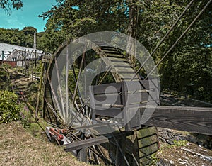 Vintage water wheel used to run Cornwalls old Tin Mines . Cornwall, England, UK