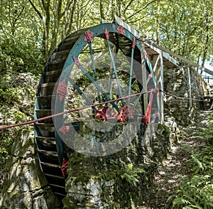 Vintage water wheel used to run Cornwalls old Tin Mines . Cornwall, England, UK