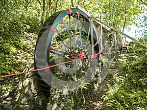 Vintage water wheel used to run Cornwalls old Tin Mines . Cornwall, England, UK