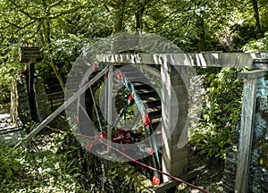 Vintage water wheel used to run Cornwalls old Tin Mines . Cornwall, England, UK