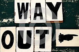 Vintage Way-out sign with pointing finger