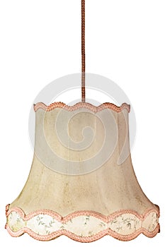 Vintage weathered lampshade with cord isolated on white