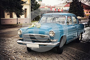 Vintage Wedding Car Decorated with Flowers.