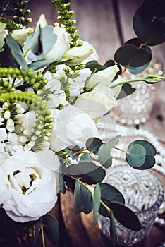 Vintage wedding decor, bouquet of white flowers and candles