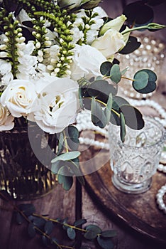 Vintage wedding decor, bouquet of white flowers and candles