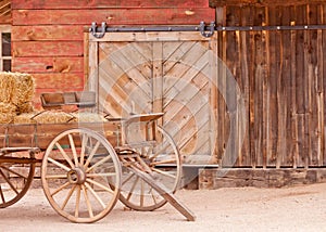 Vintage western horse cart loaded with straw bales