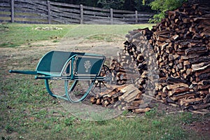 Vintage Wheelbarrow and Woodpile photo