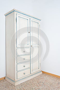 Vintage white armoire furniture in house photo