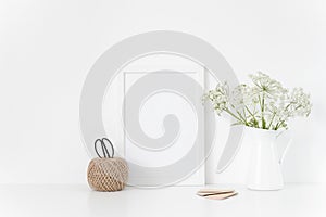 Vintage white frame a4 mock up with herbal a in vase.Mockup for design.Template for businesses,lifestyle bloggers, media