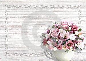 Vintage white wood background with flowers in a vintage pot Shabby Chic.