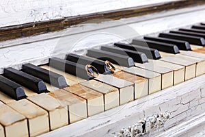 Wedding rings on piano keys