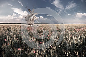 Vintage Windmill on Wheat Field