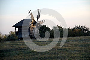 Vintage windmill wooden mill with wind wheel blades