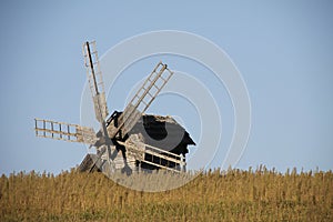 Vintage windmill wooden mill with wind wheel blades