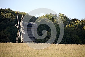 Vintage windmill wooden mill with wind wheel blades