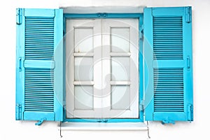 Vintage window with blue shutter